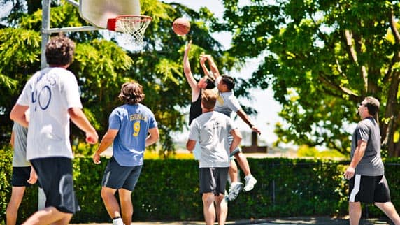 7 Digital Foundry software engineers and consultants playing basketball outside in Tiburon